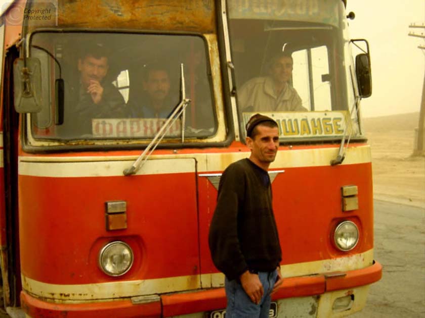 Man in front of Bus in Tajikistan